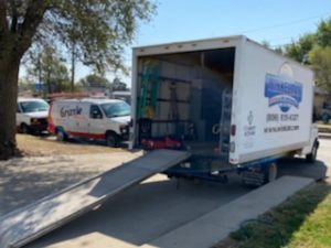 Winkelman Heating & Air Conditioning service vehicle at residential home in Dumas, TX.