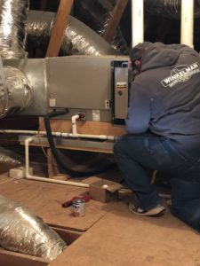Winkelman Heating & Air Conditioning technician performing a furnace installation in Dumas, TX.