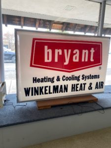 Old-fashioned Bryant Heating & Cooling System, Winkelman Heating & Air sign.