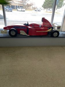 Mini Winkelman Heating & Air Conditioning Formula One car in Dumas, TX, office.